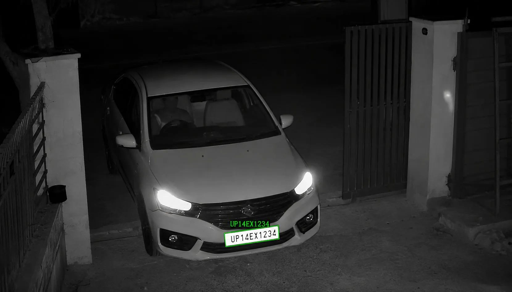ANPR reading a number plate on a car at a gate at night